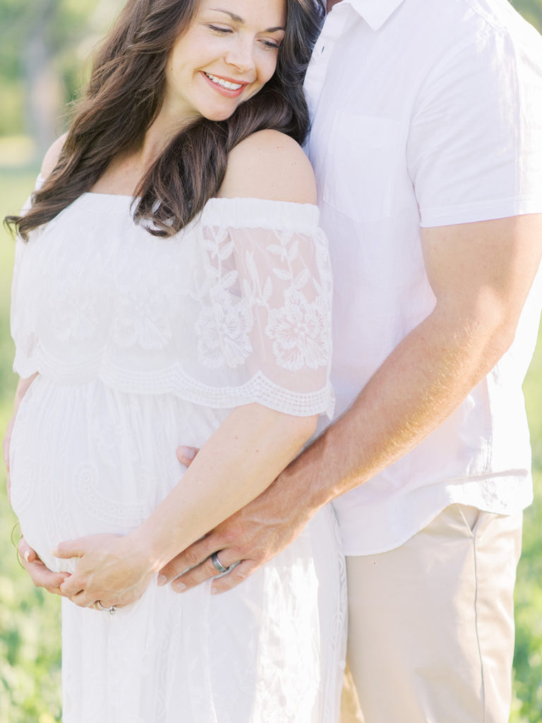 excited parents waiting for their baby to come during their Littleton maternity session