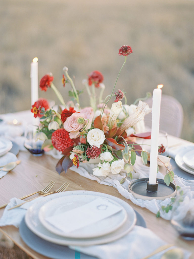 Table centerpiece florals created by Helios Floral photographed by Decorus photography during a Romantic Al Fresco Wedding Inspiration at Stonewall Farm